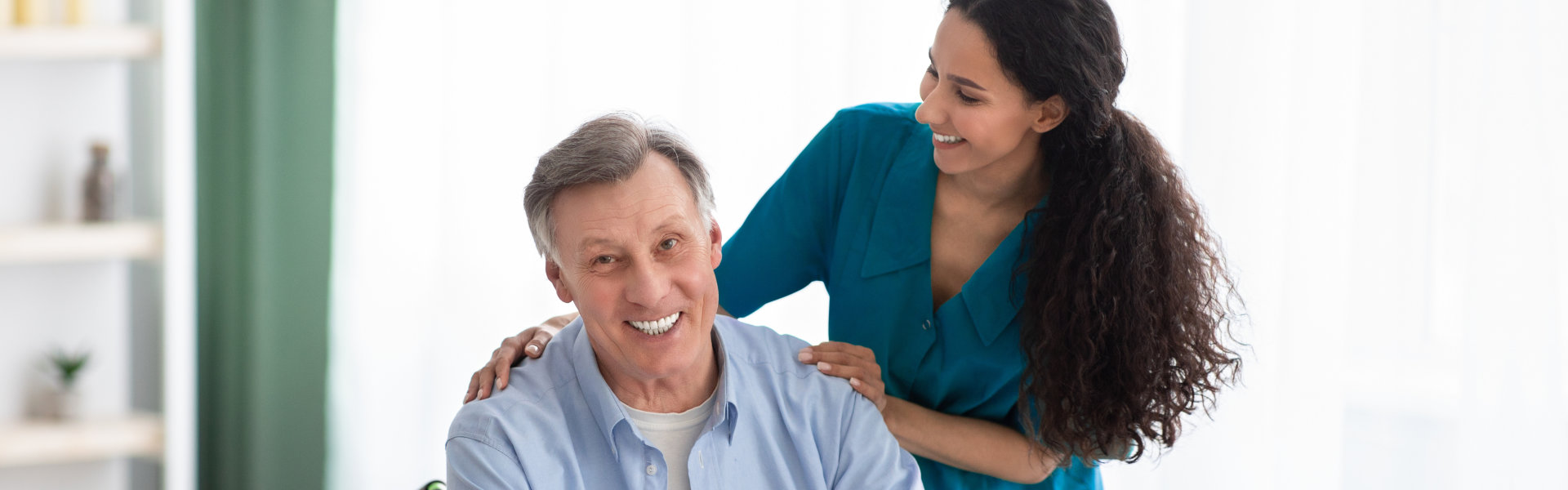 caregiver and senior man on a wheelchair